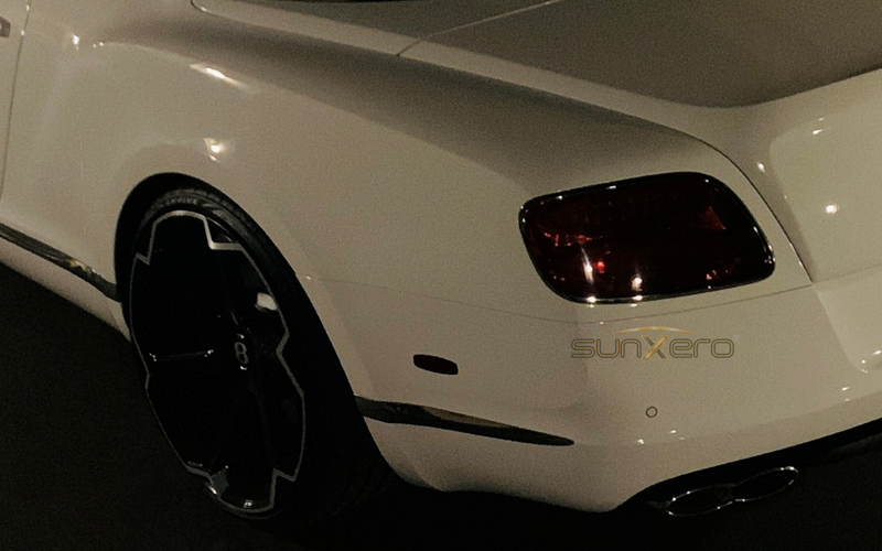 Smoked tinted headlights and taillights on vehicle