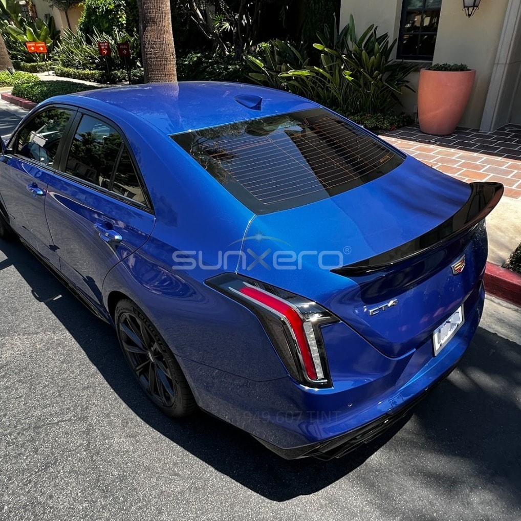 Blue Cadillac CTS — Driveway