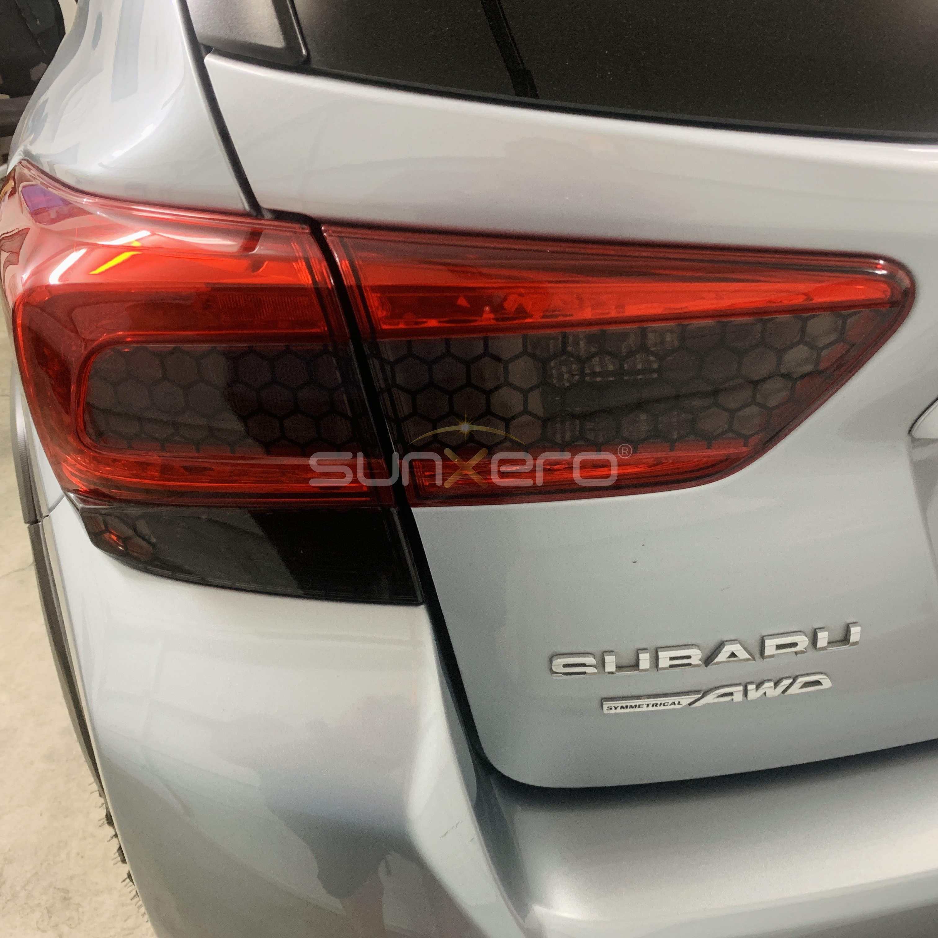 White Subaru AWD — Taillight