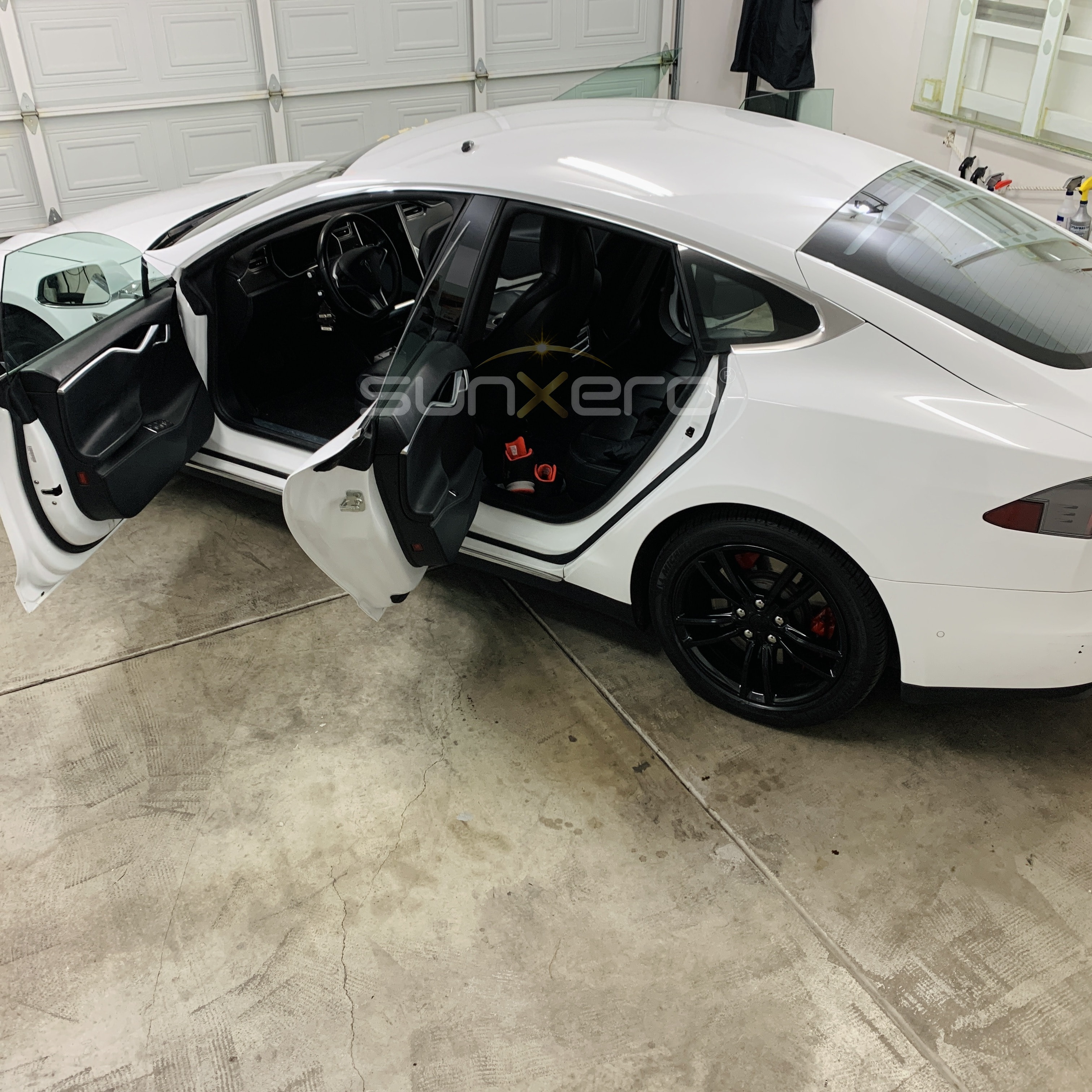 White Sports Car — Doors Open Garage