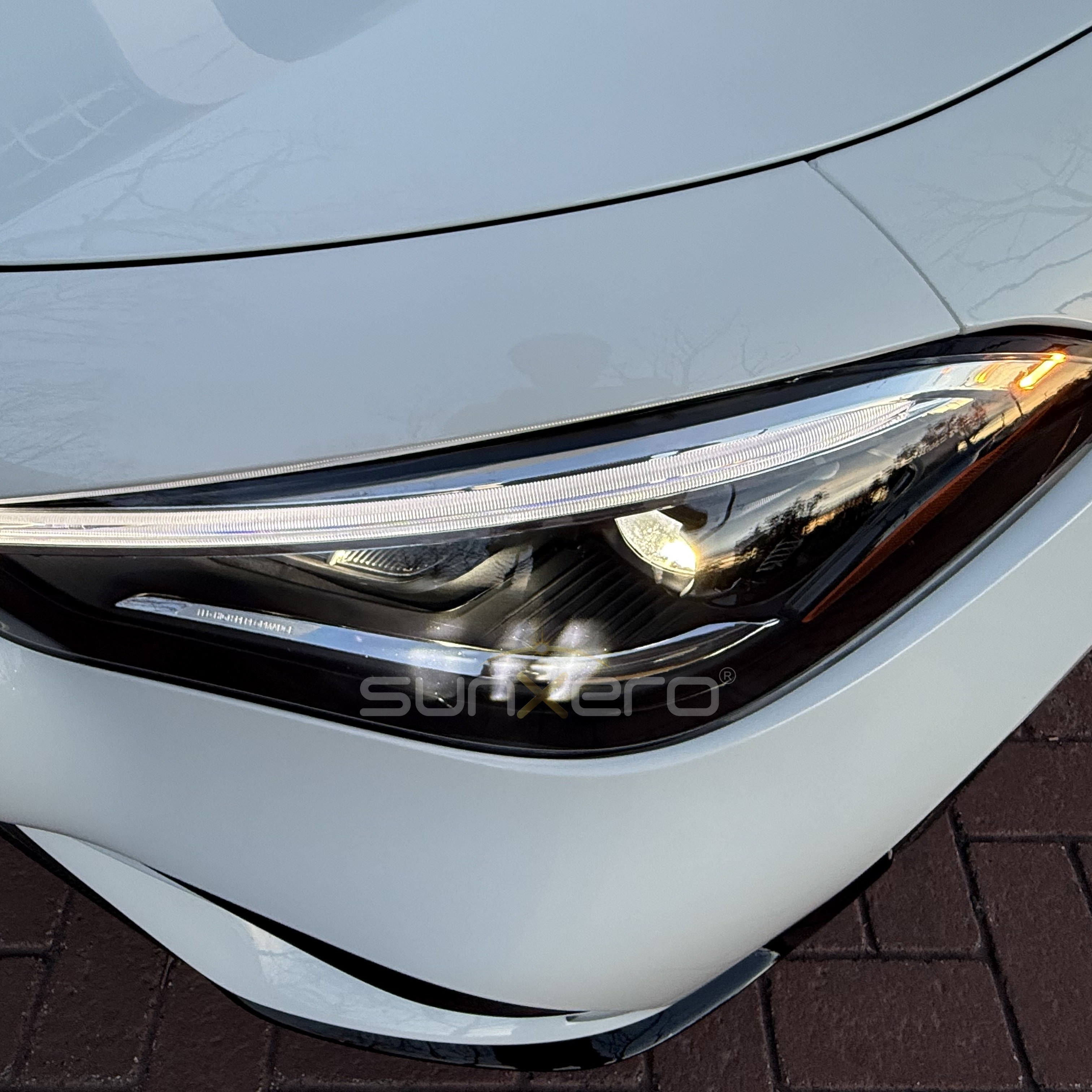 White Car — Headlight Close-Up