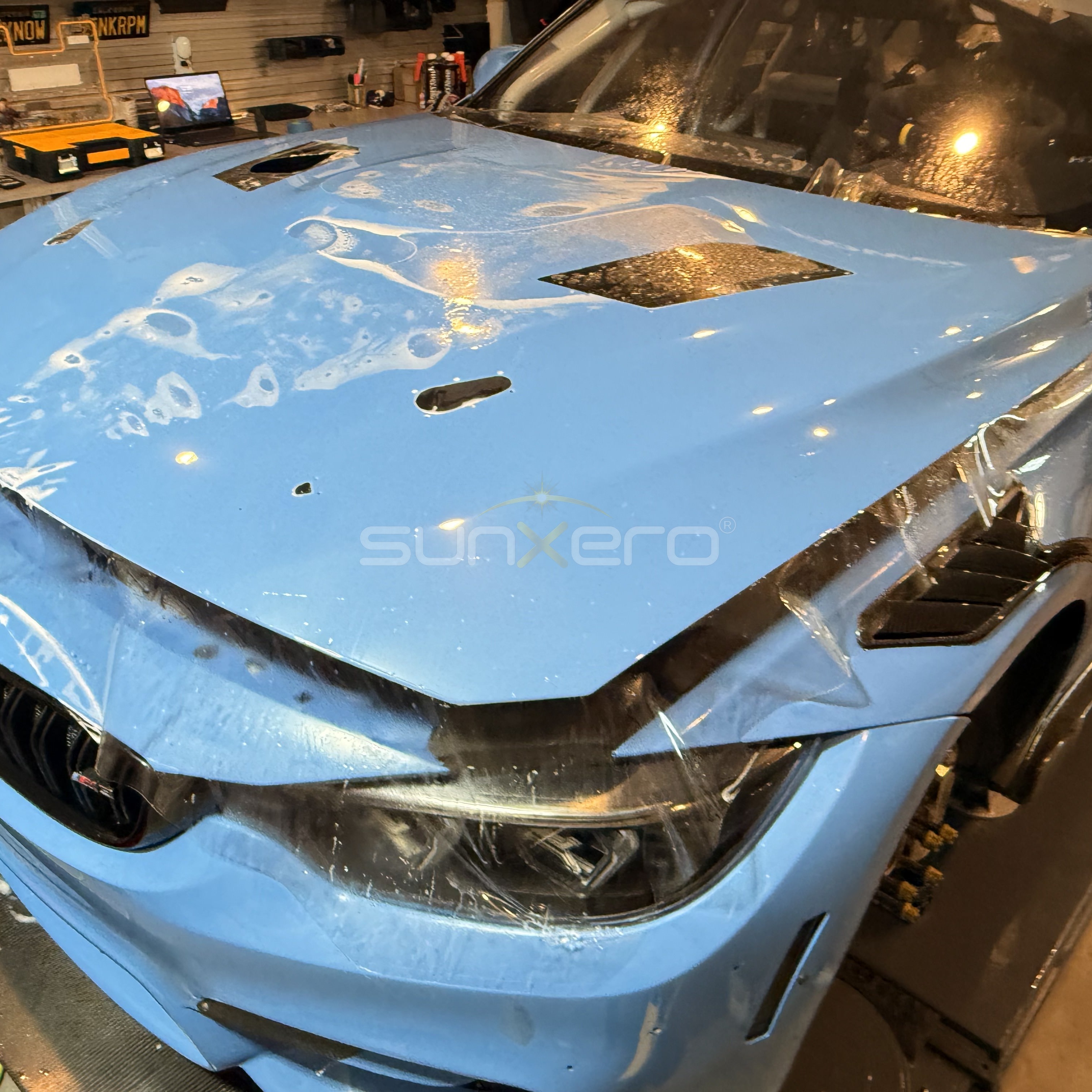 Blue Car Hood — Workshop Damage