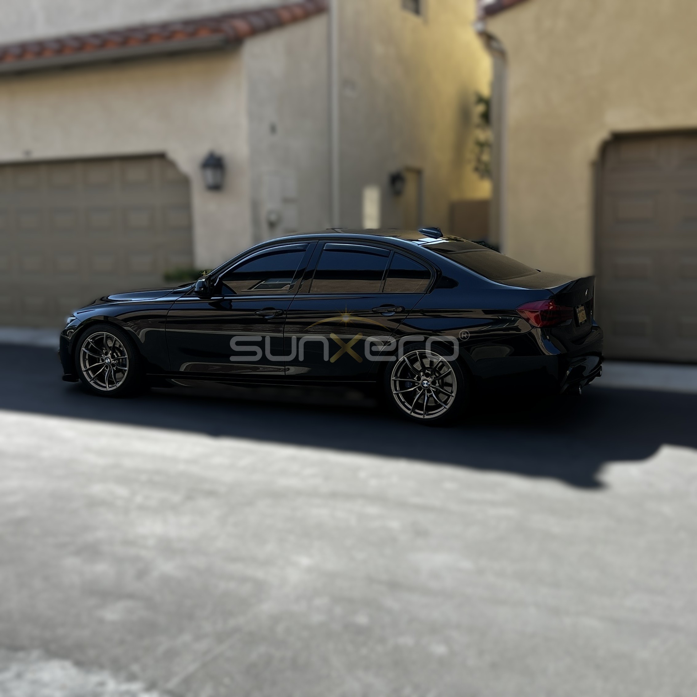 Black Sports Sedan — Driveway
