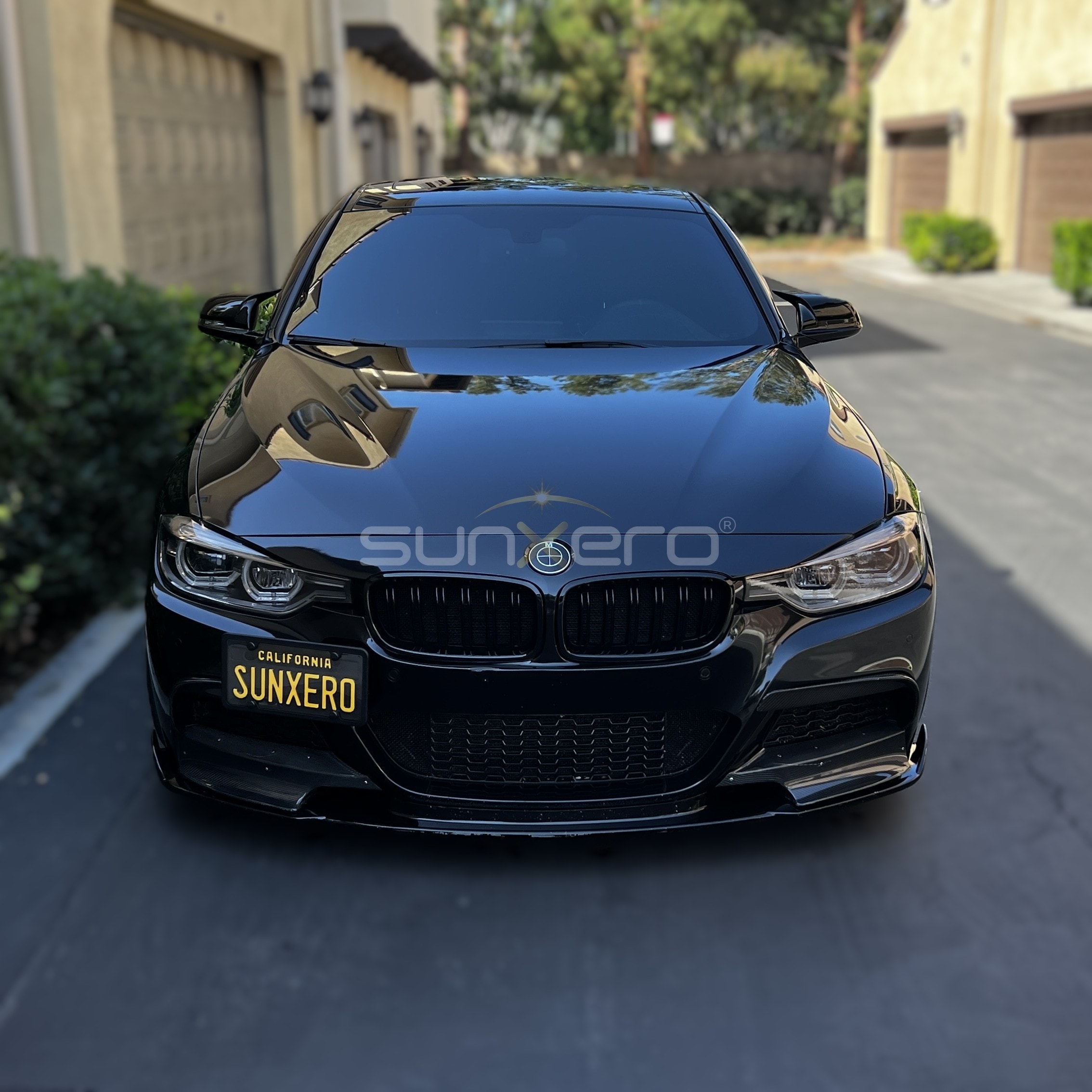Black BMW Sedan — Driveway