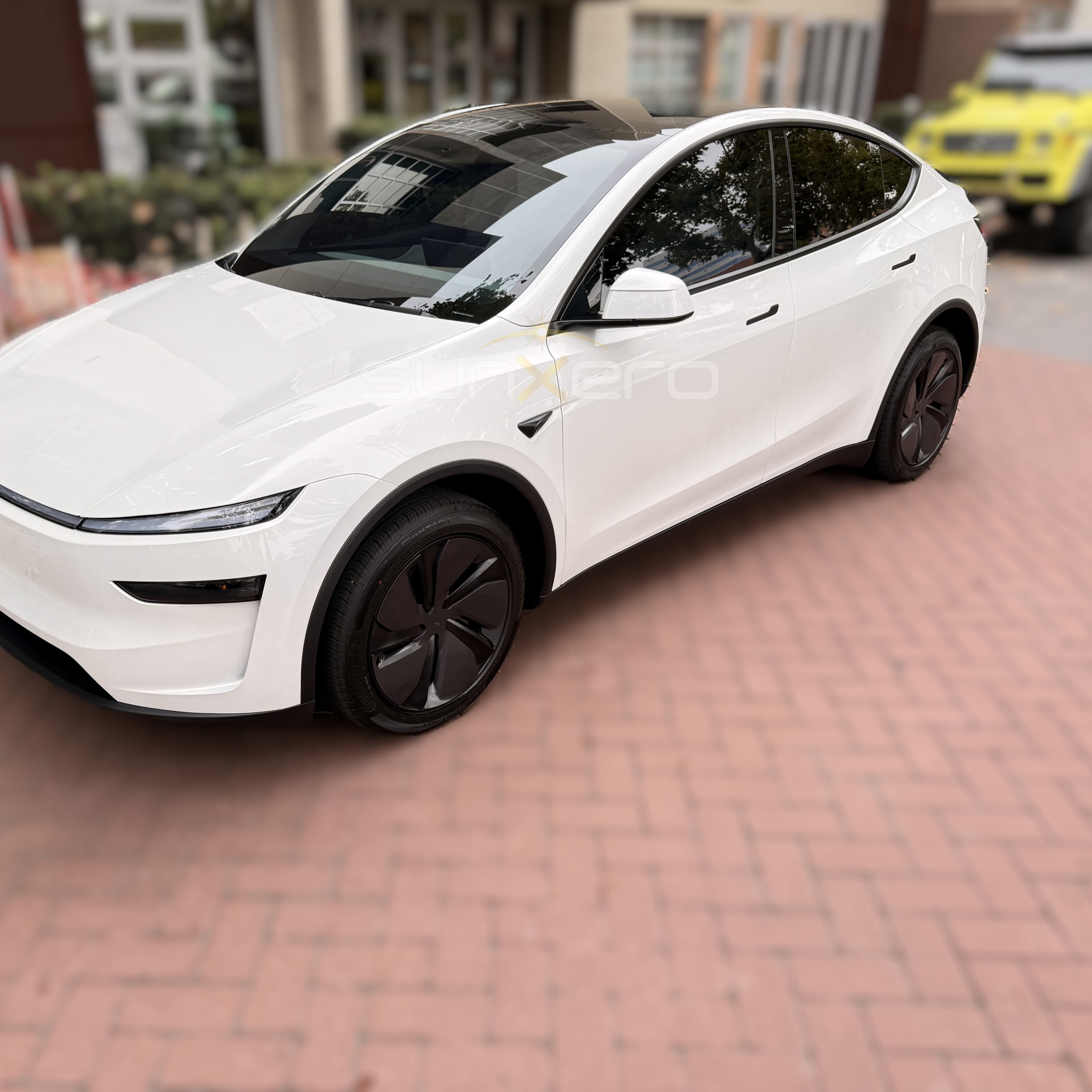 White Tesla Model Y — Tinted