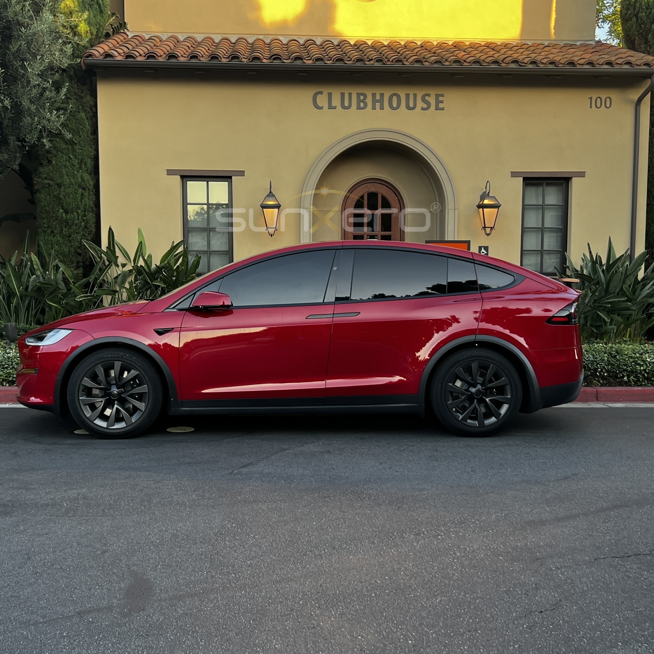 Red Tesla — Clubhouse Parked