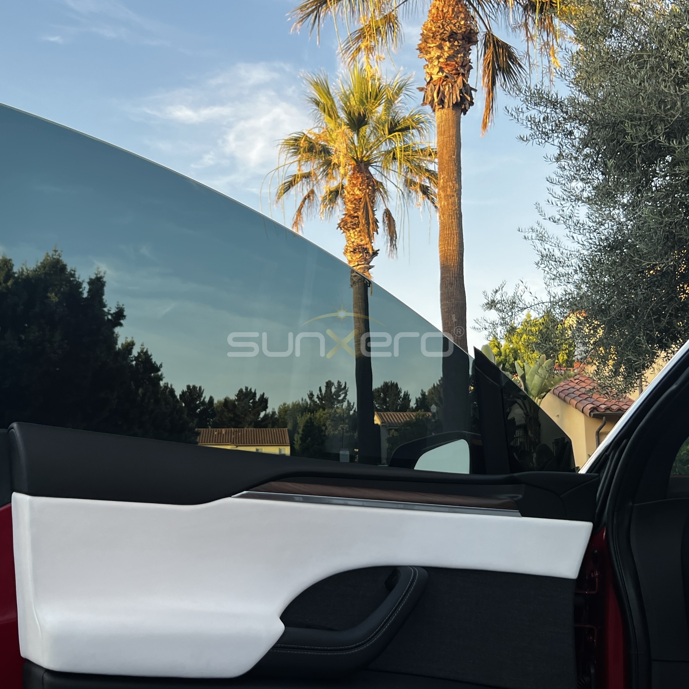 Red Tesla — Gull Wing Doors Open
