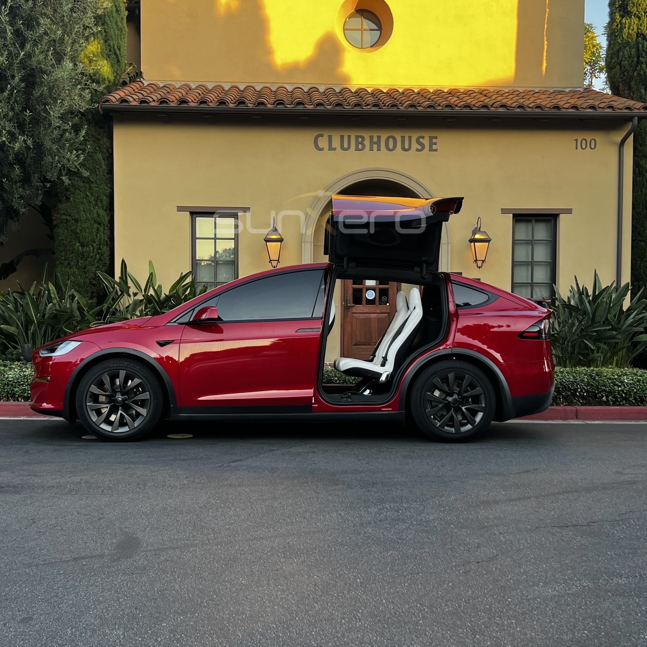Red Tesla X — Falcon Doors Open