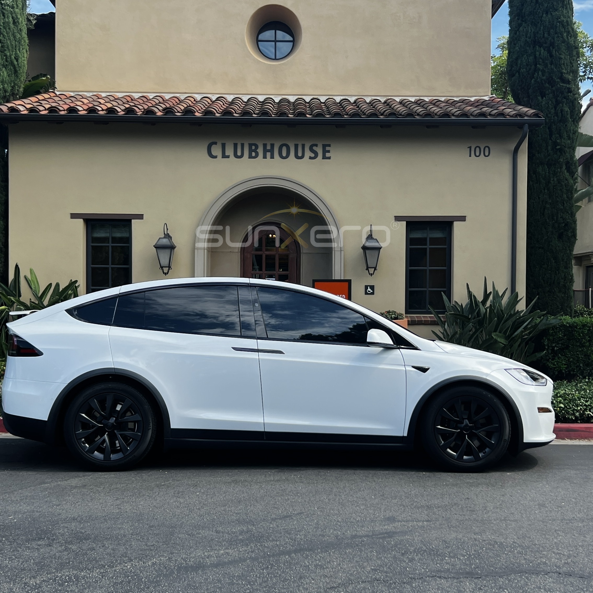White EV SUV — Clubhouse Building