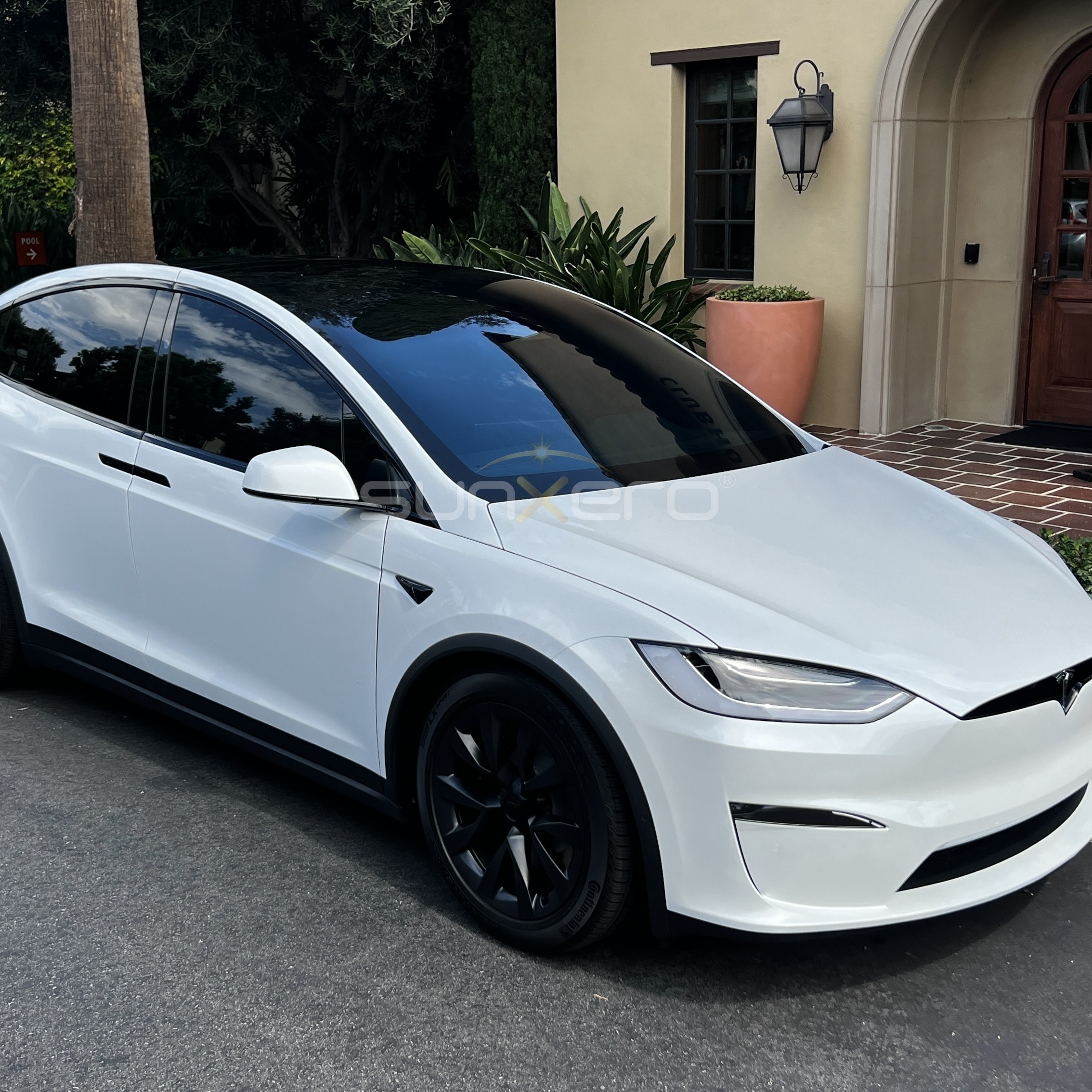 White Tesla — Luxury Home Driveway