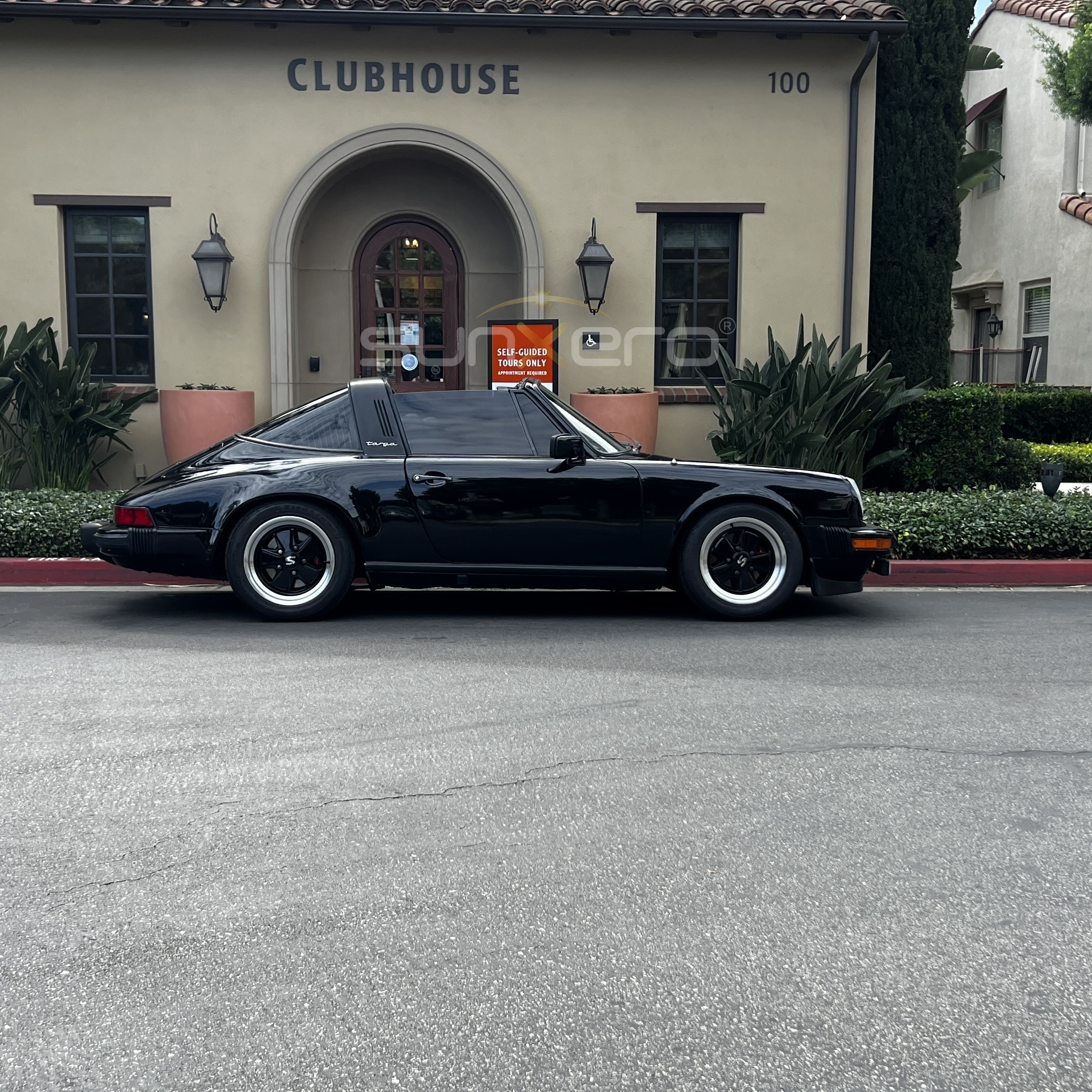 Black Sports Car — Clubhouse Building