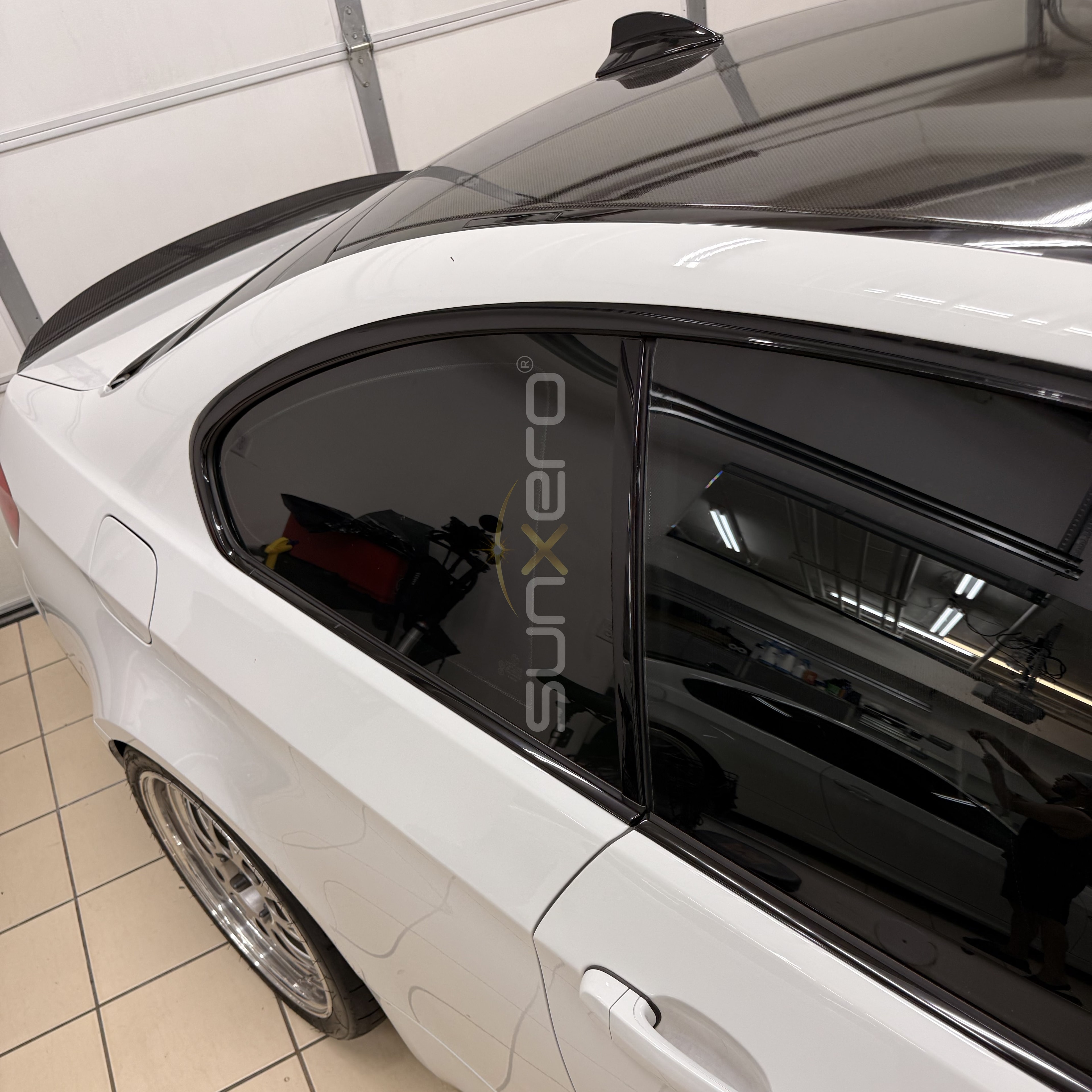 White Car — Tinted Windows Indoors